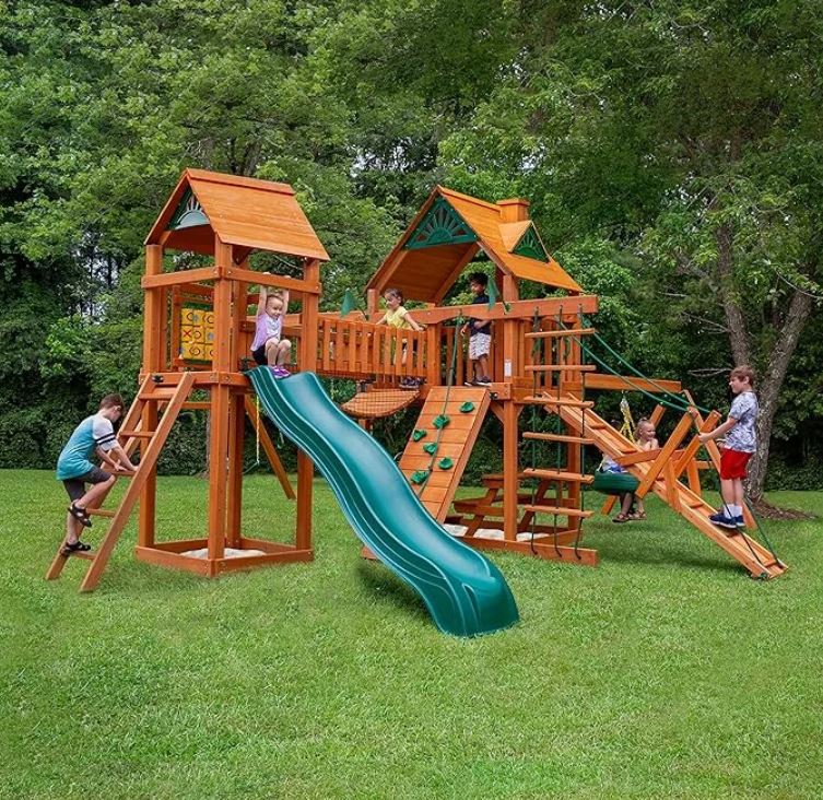 Gorilla Playsets Pioneer Peak Treehouse Wooden Swing Set with Tire Swing, and Clatter Bridge and Tower